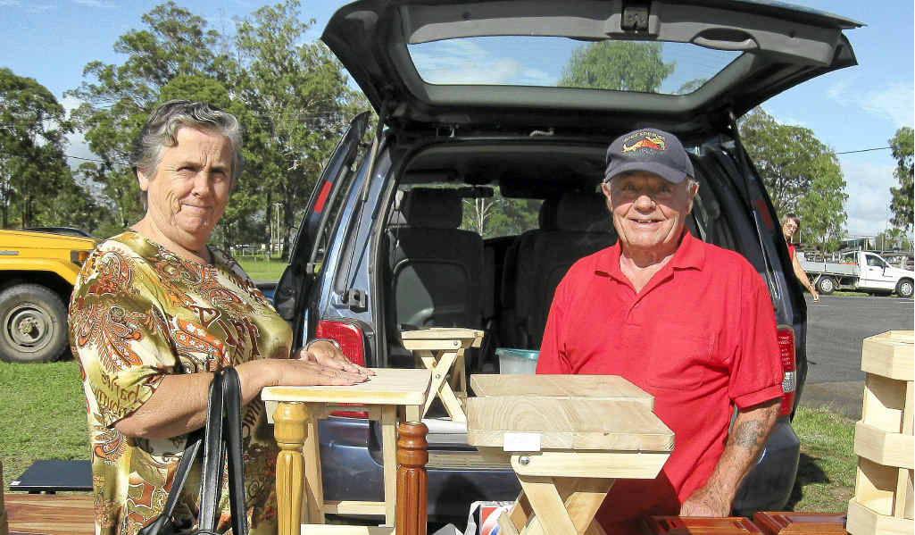Ted Senior at his market stall showing handcrafted items to local resident Marilyn Dumpleton. Ted Senior at his market stall showing handcrafted items to local resident Marilyn Dumpleton.